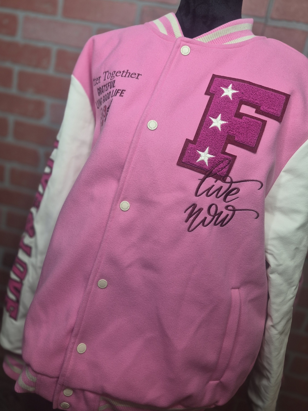 This Rebel Minds Live & Love Varsity Jacket